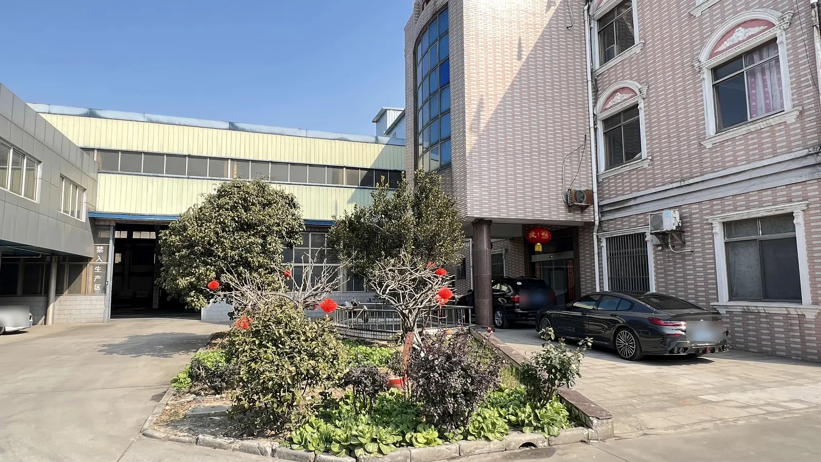 Courtyard and workshop buildings at the Longyu manufacturing site in Jiangyin