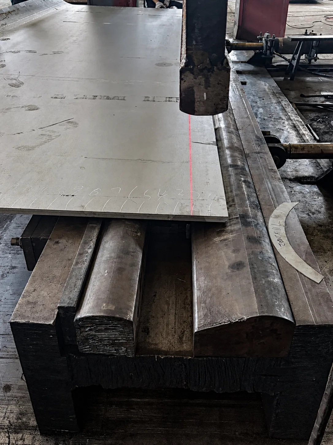 Close view of plate positioning on the NOKX 8000-ton bending press